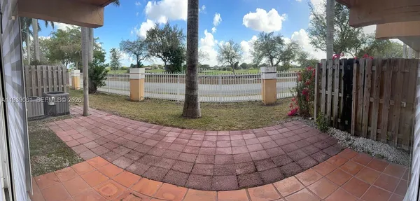 a view of a garden with a fountain