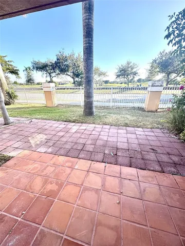 a view of a terrace with yard