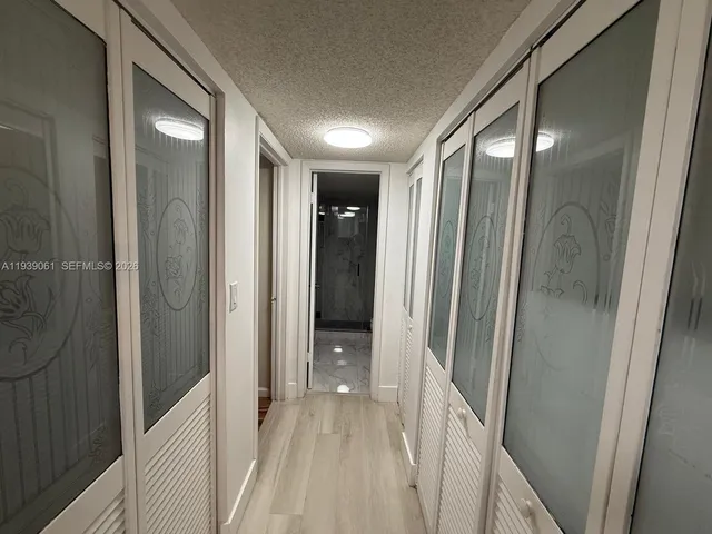 a view of a bathroom from a hallway