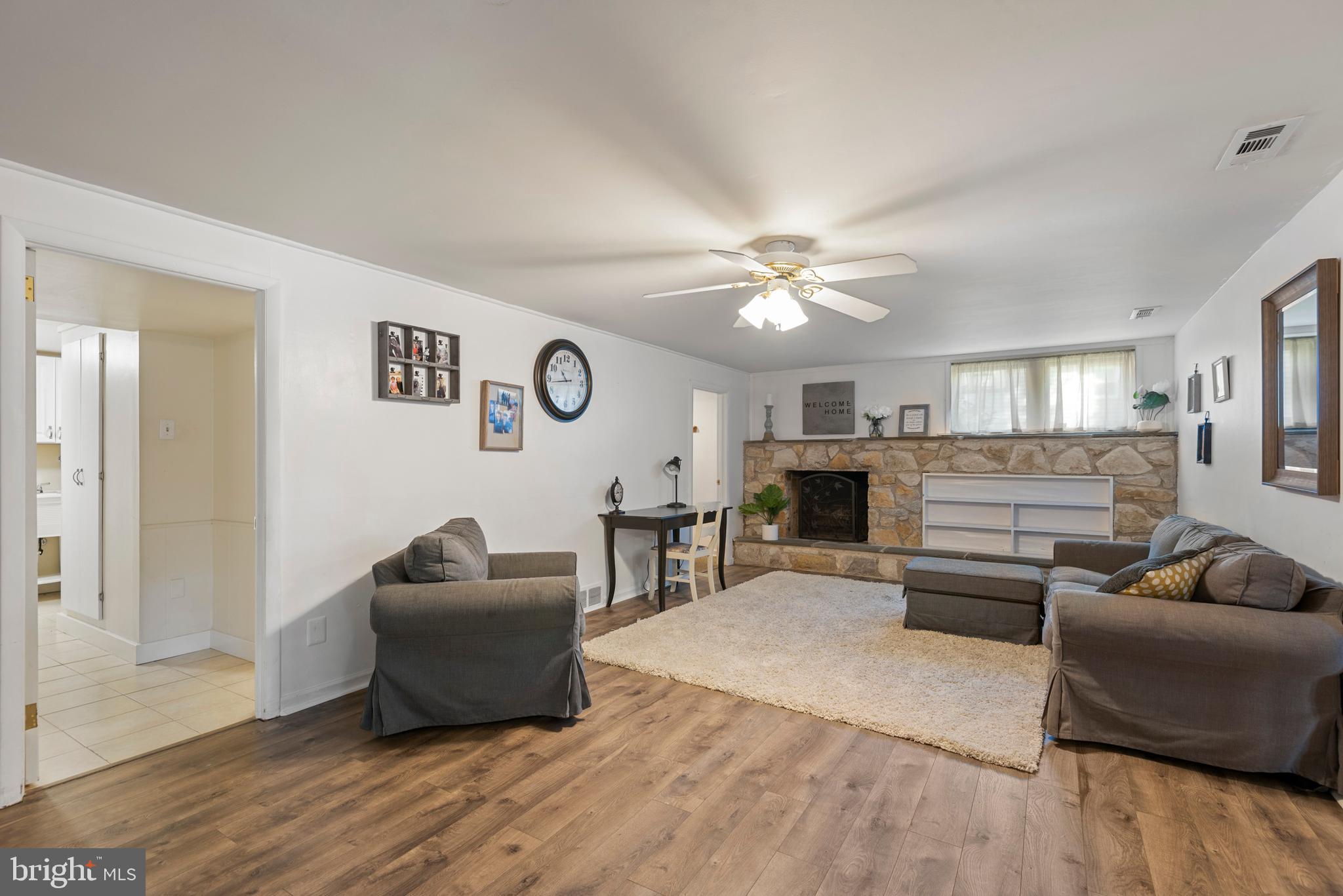 1736 Aidenn Lair Road Dresher, PA 19025 - Photo 23 of 36 Family room lower level with stone fireplace
