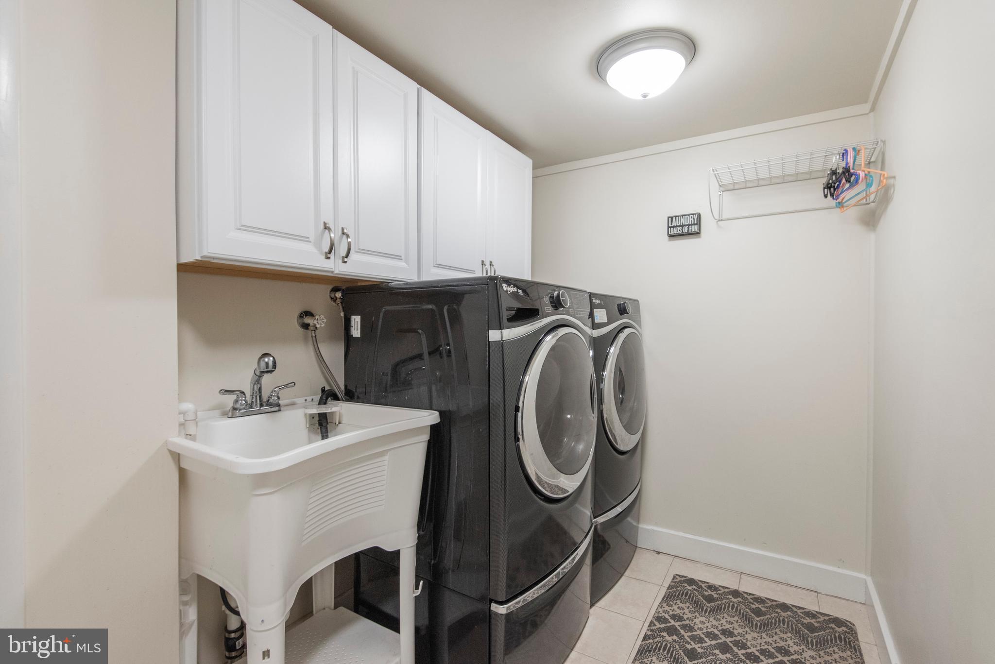 1736 Aidenn Lair Road Dresher, PA 19025 - Photo 30 of 36 Laundry room w/utility tub and cabinets