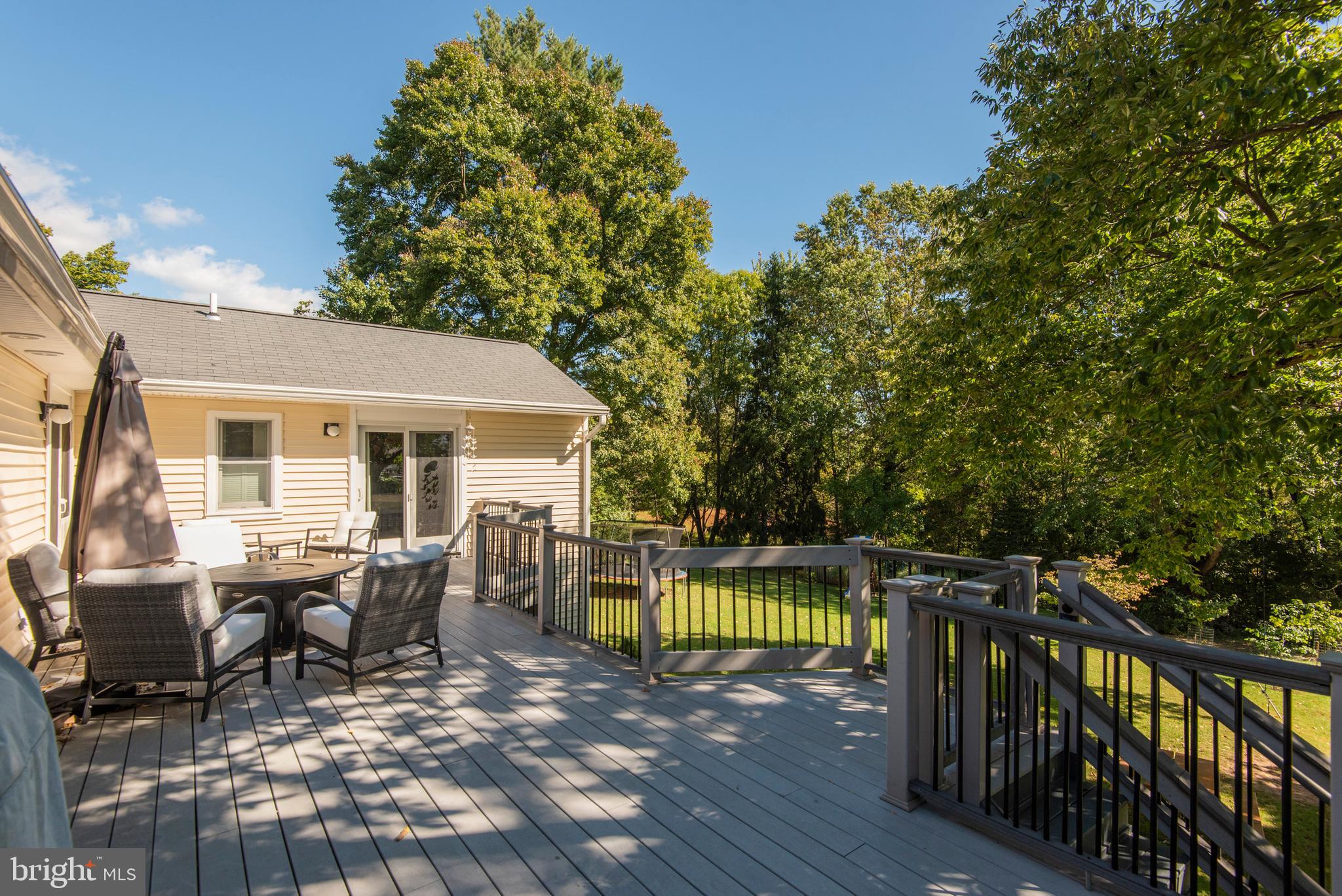 1736 Aidenn Lair Road Dresher, PA 19025 - Photo 32 of 36 Deck at rear has stairs to half acre yard