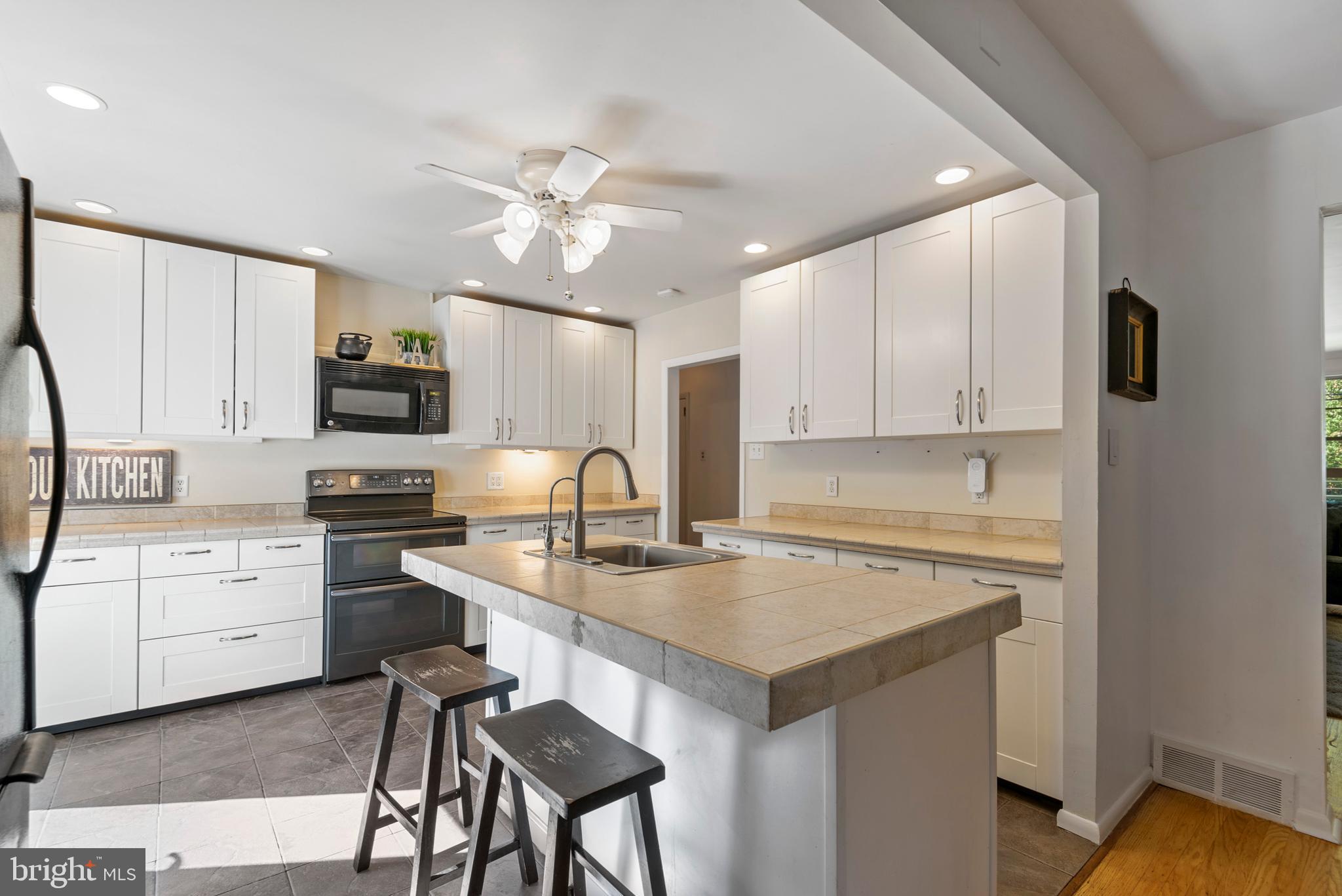 1736 Aidenn Lair Road Dresher, PA 19025 - Photo 8 of 36 Kitchen w/island, stone counters, recessed lights
