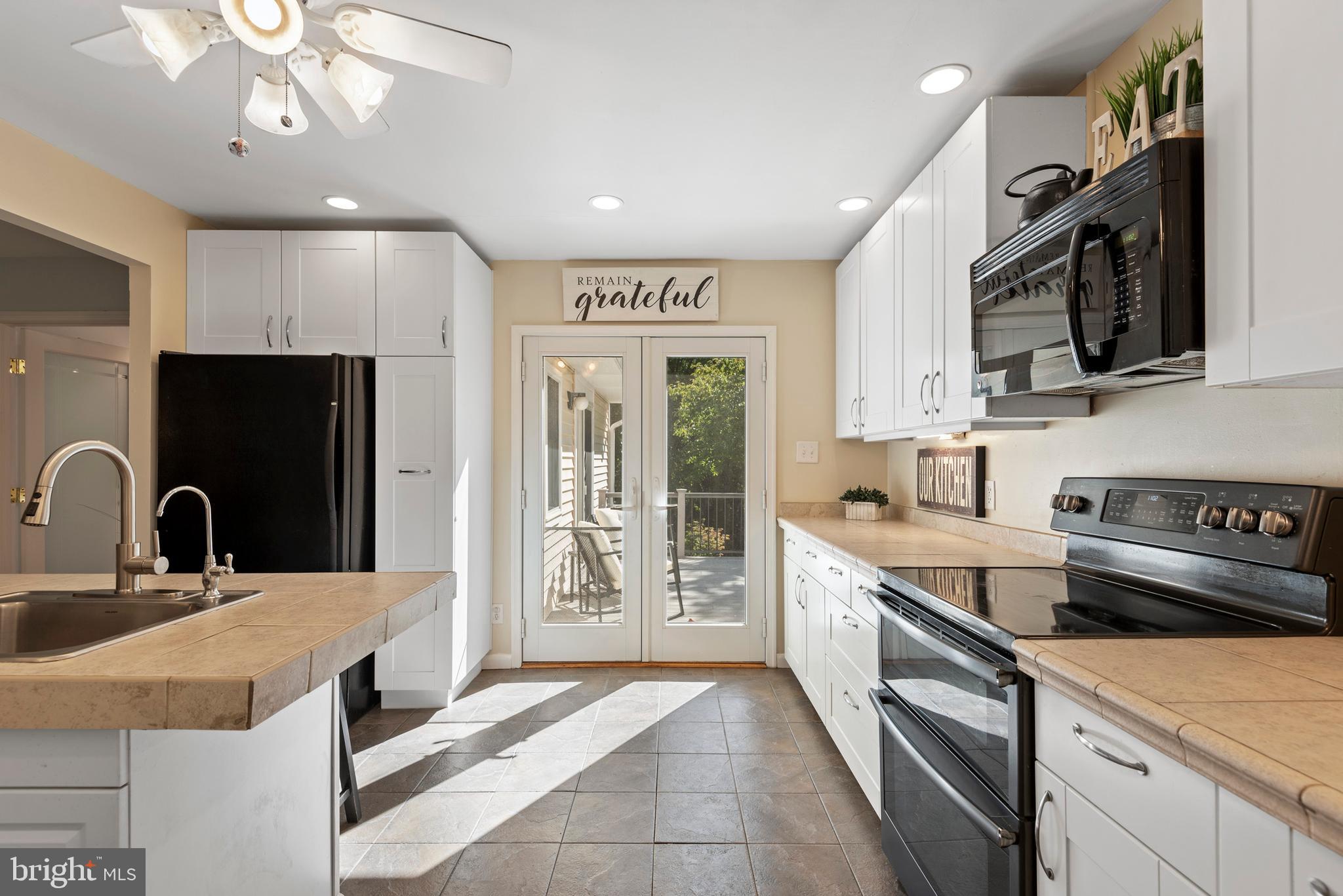 1736 Aidenn Lair Road Dresher, PA 19025 - Photo 9 of 36 Kitchen, French door to deck, appliances included