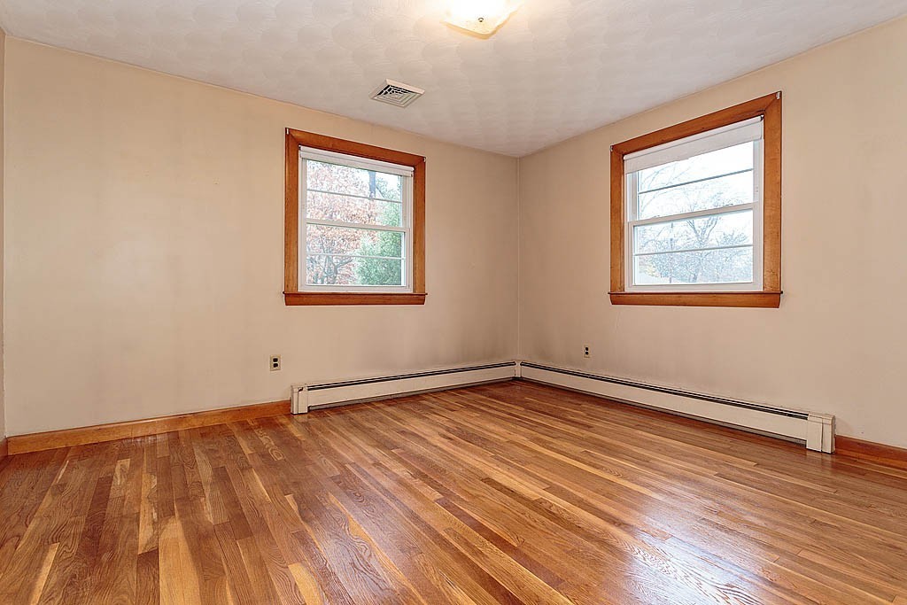 20 South Rhoda Street Tewksbury, MA 01876 - Photo 14 of 24 an empty room with wooden floor and windows