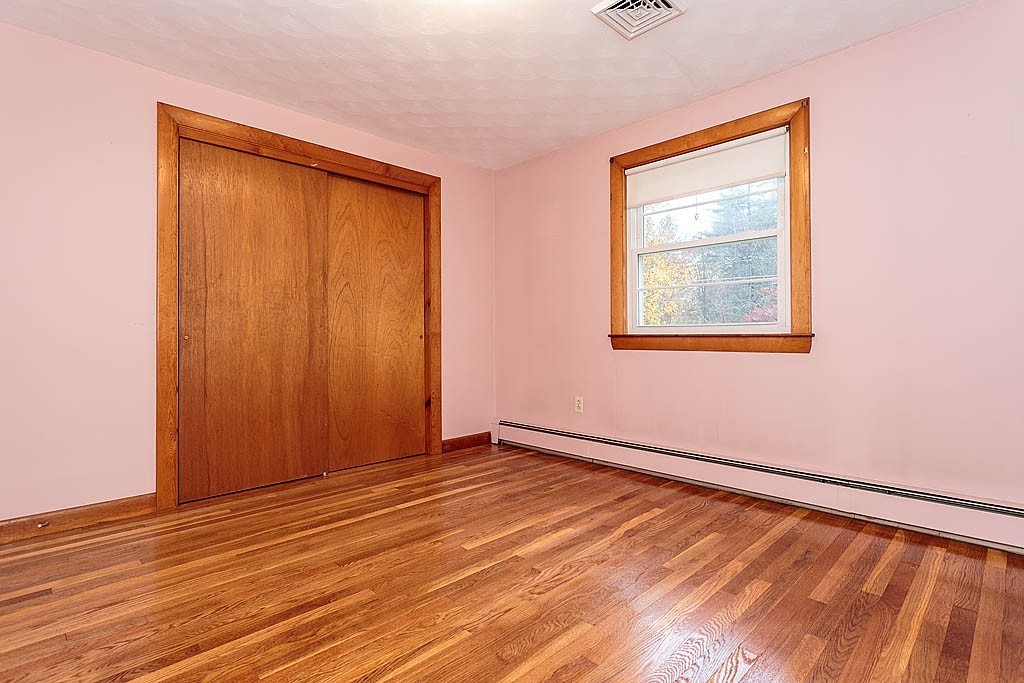 20 South Rhoda Street Tewksbury, MA 01876 - Photo 15 of 24 an empty room with wooden floor and windows
