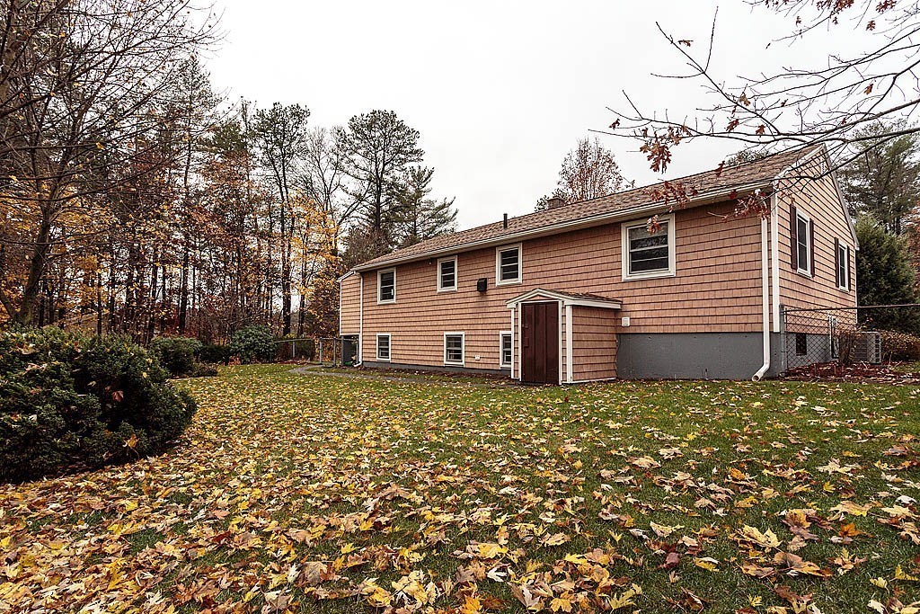 20 South Rhoda Street Tewksbury, MA 01876 - Photo 4 of 24 a view of a house with a yard