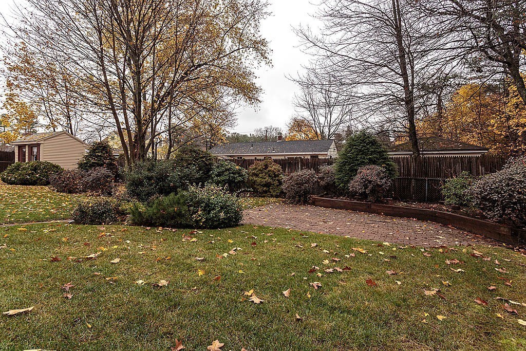 20 South Rhoda Street Tewksbury, MA 01876 - Photo 6 of 24 a view of a backyard with potted plants and large trees