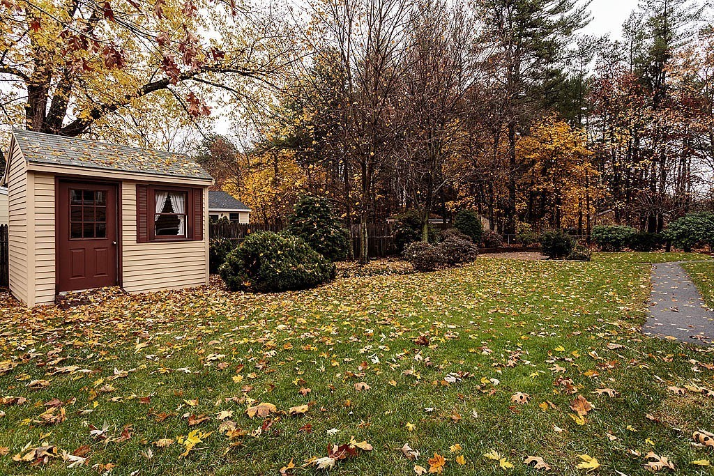 20 South Rhoda Street Tewksbury, MA 01876 - Photo 7 of 24 a house with trees in front of it