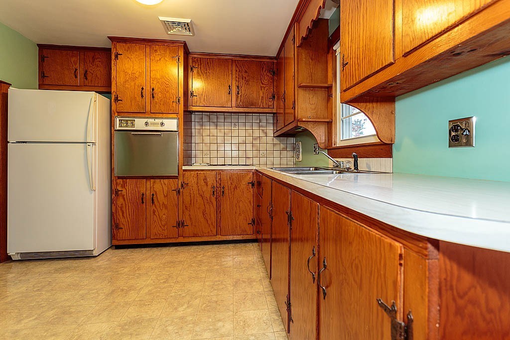 20 South Rhoda Street Tewksbury, MA 01876 - Photo 9 of 24 a view of kitchen with a refrigerator