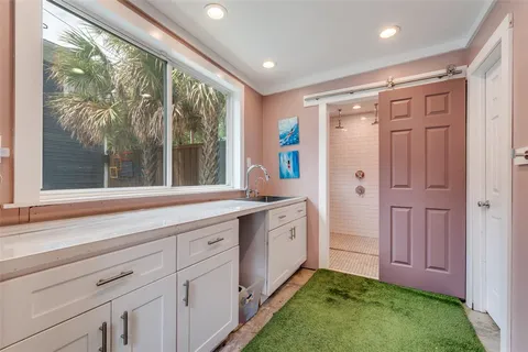 a bathroom with a double vanity sink and a large mirror