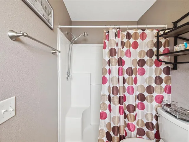 a bathroom with a shower curtain