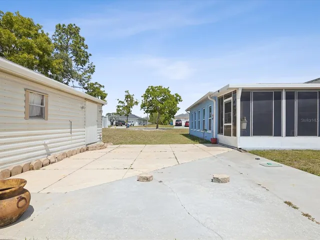 a backyard of a house with lots of green space