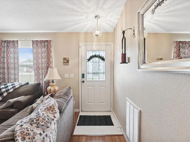 a bedroom with furniture and a window