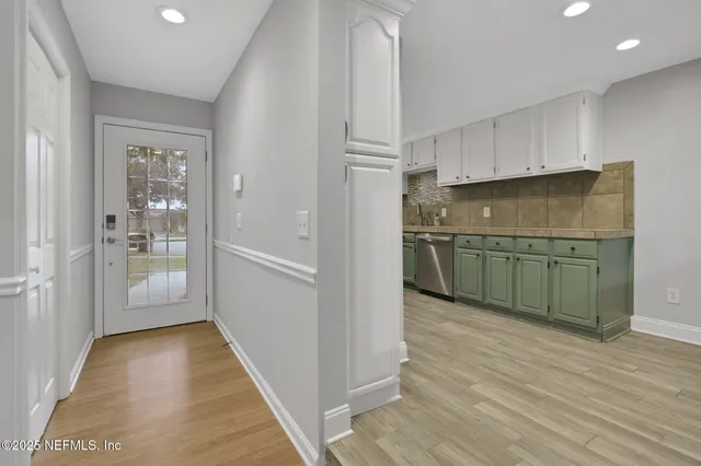 a kitchen with a refrigerator a sink and dishwasher