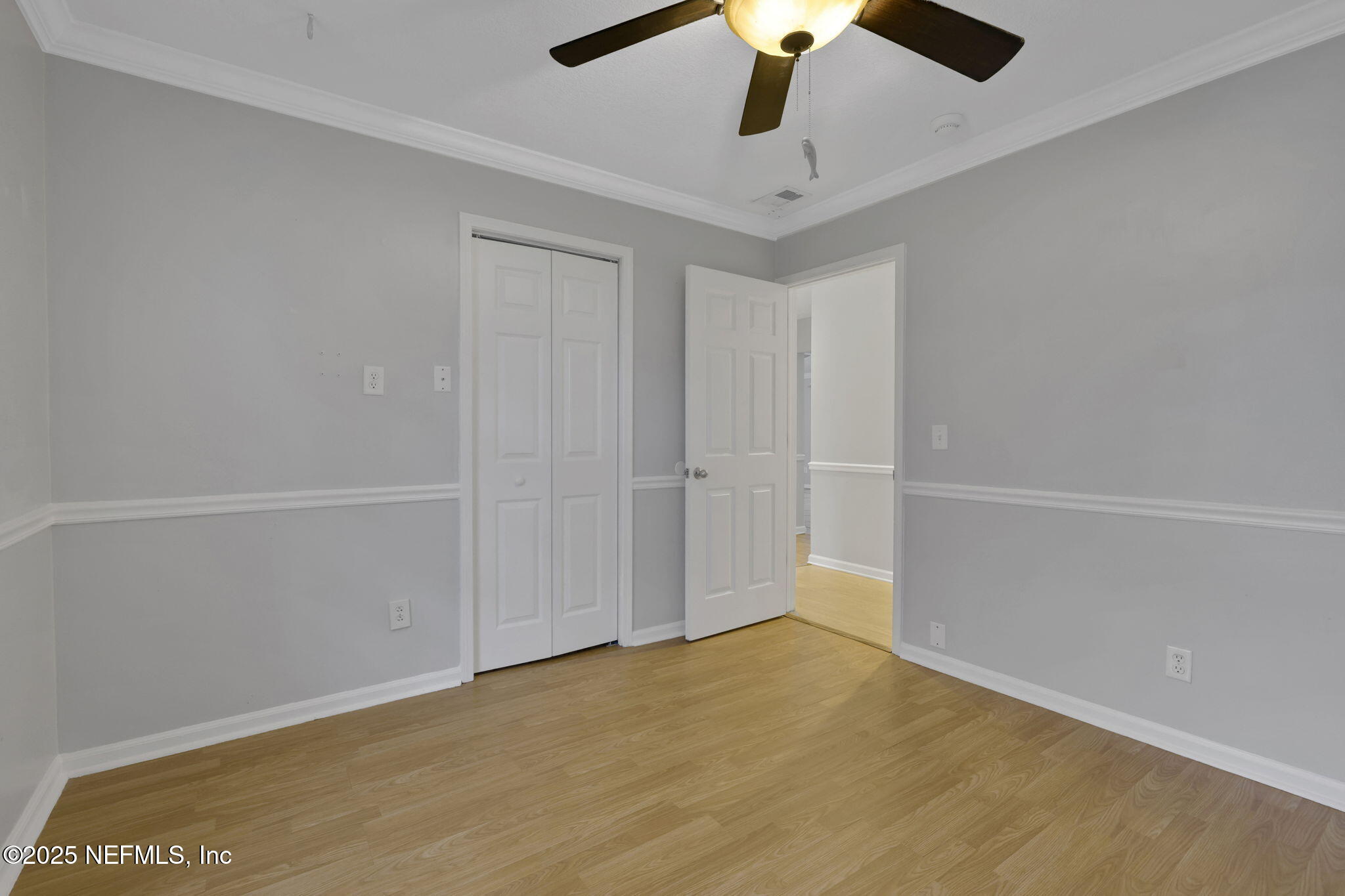3452 North Ride Court Jacksonville, FL 32223 - Photo 21 of 39 an empty room with a ceiling fan and a window