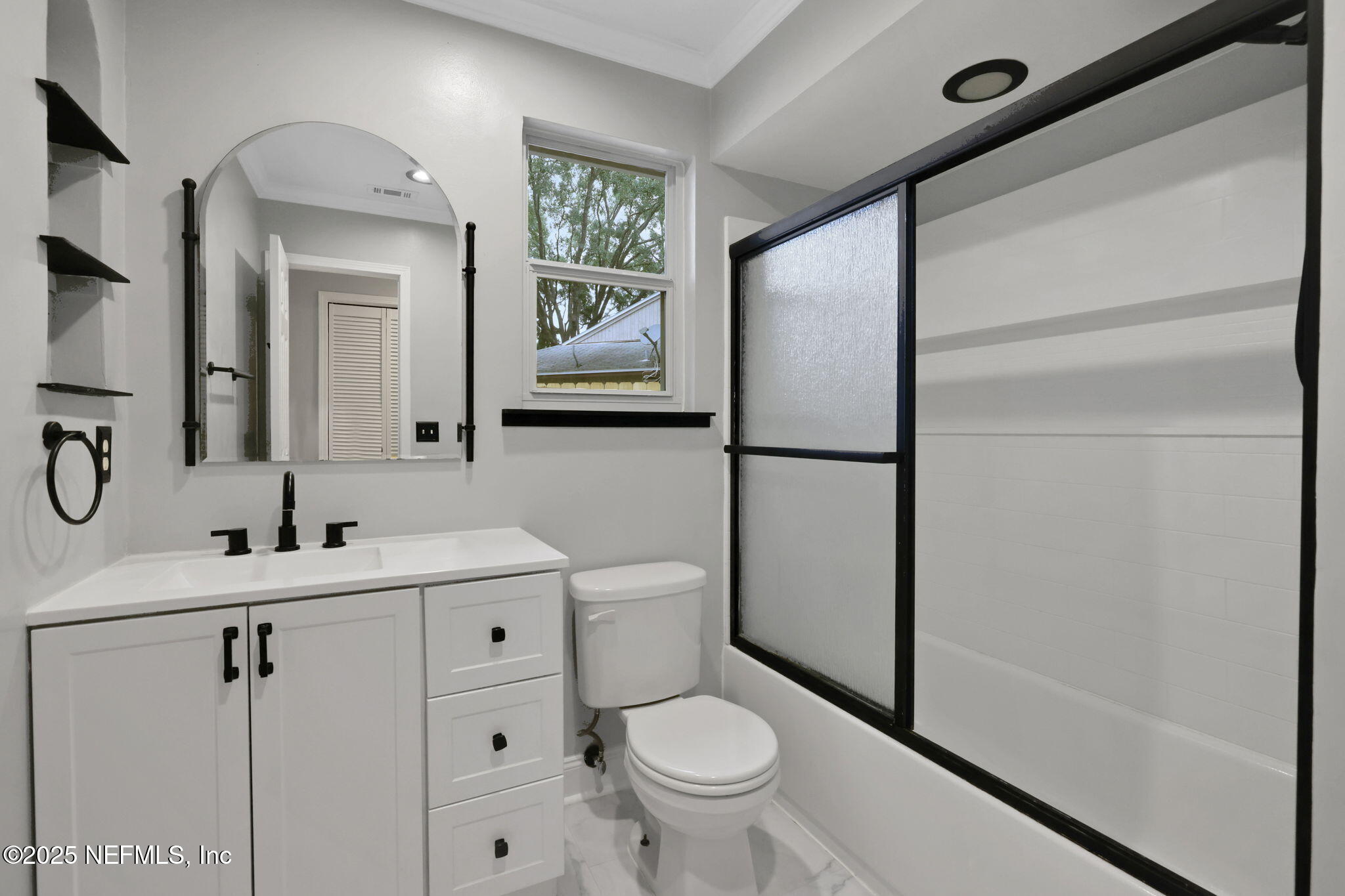 3452 North Ride Court Jacksonville, FL 32223 - Photo 24 of 39 a bathroom with a toilet sink and mirror