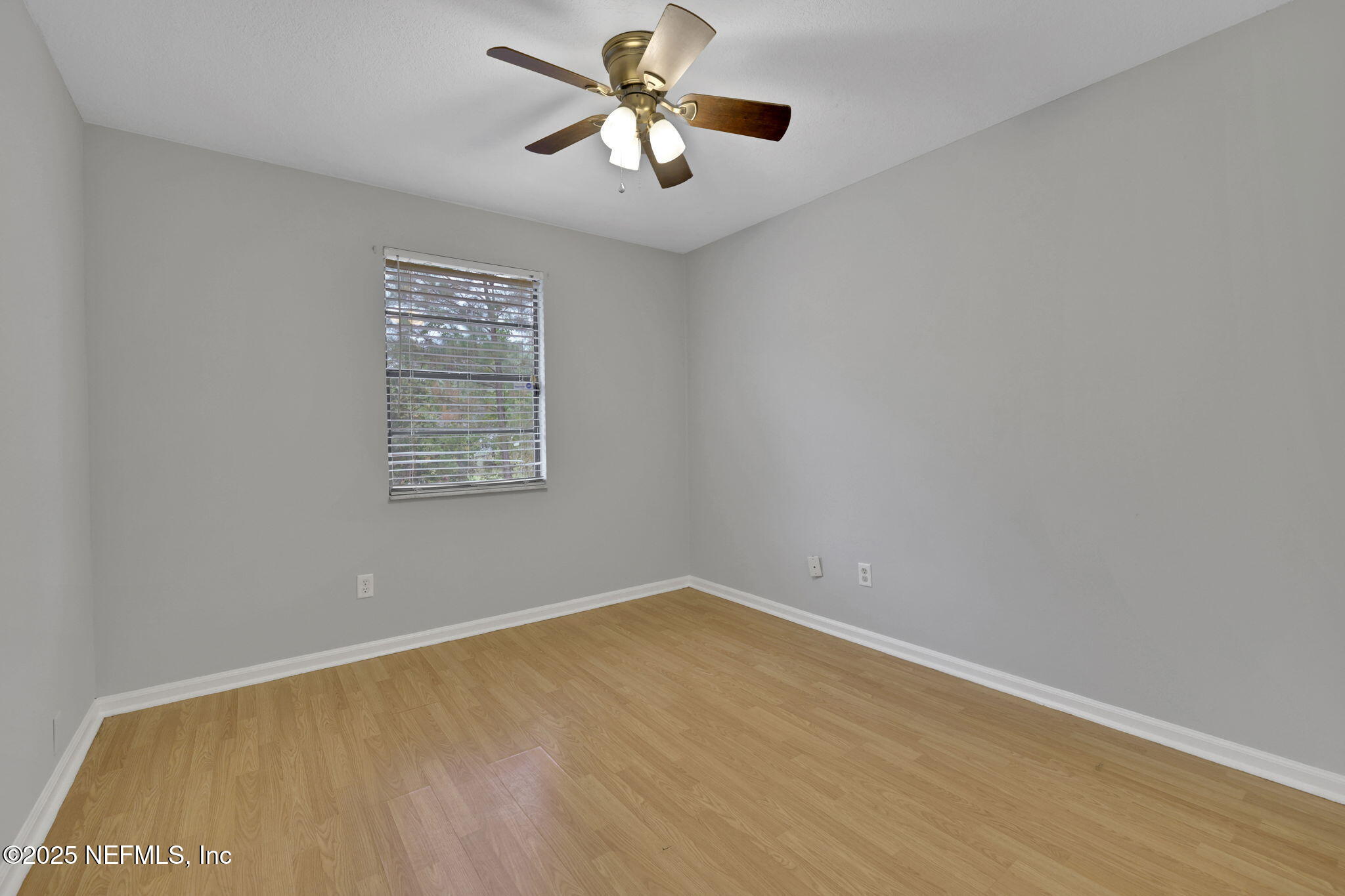 3452 North Ride Court Jacksonville, FL 32223 - Photo 26 of 39 wooden floor in an empty room with a window