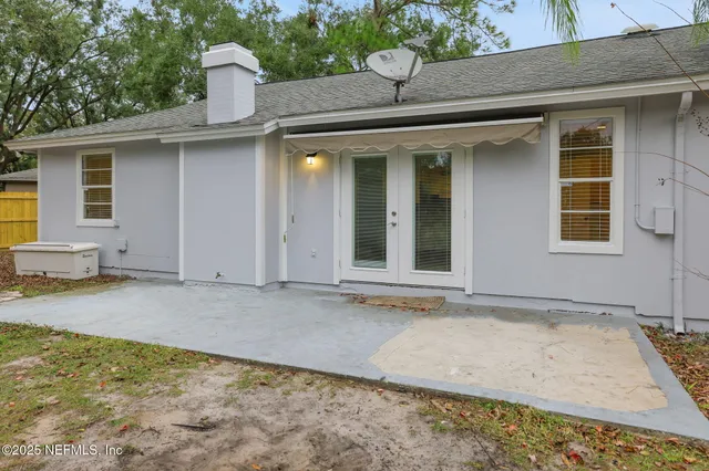 a house with trees in front of it