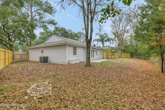 a house view with a backyard space
