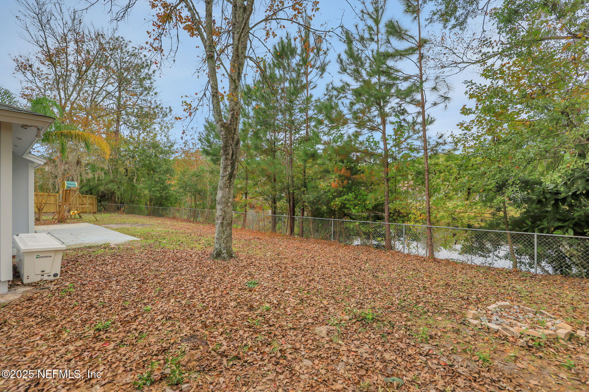 3452 North Ride Court Jacksonville, FL 32223 - Photo 33 of 39 a backyard of a house with lots of green space