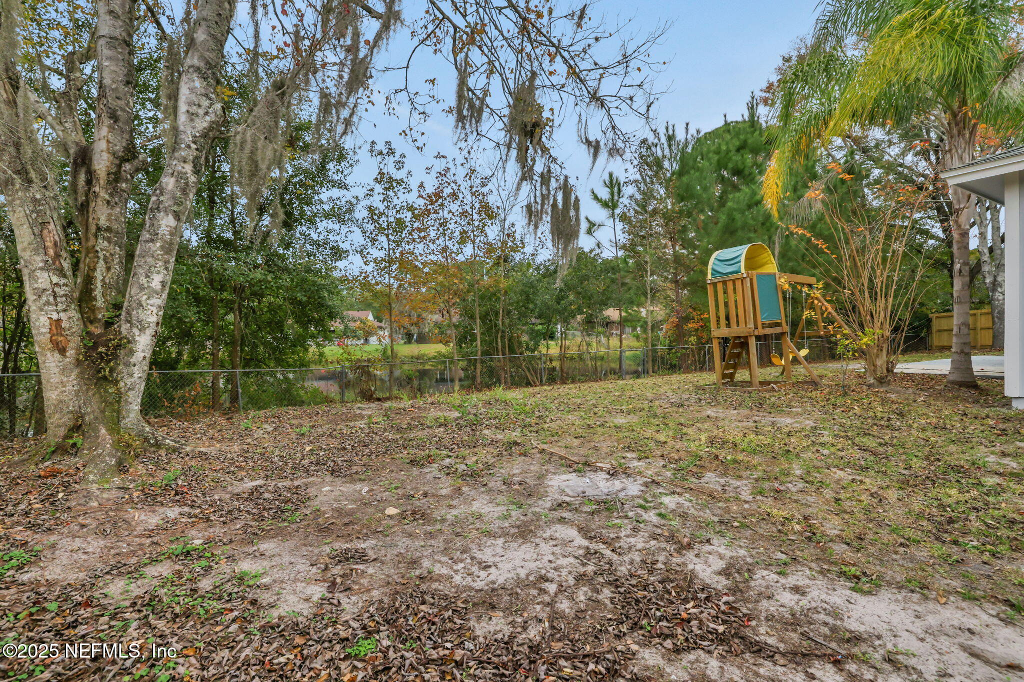 3452 North Ride Court Jacksonville, FL 32223 - Photo 34 of 39 a backyard of a house with lots of green space