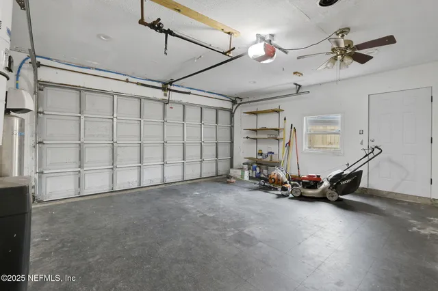 a front view of a house with a garden and trees