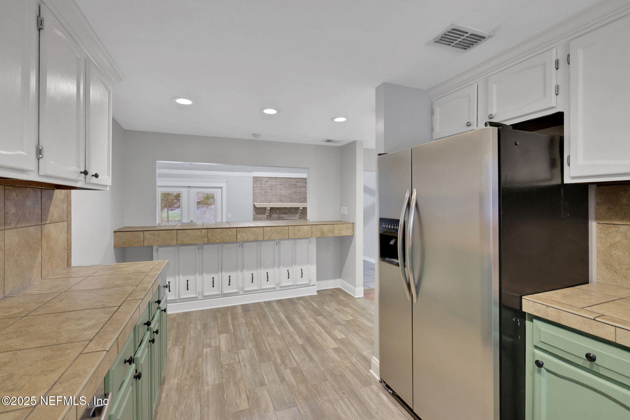 3452 North Ride Court Jacksonville, FL 32223 - Photo 6 of 39 a kitchen with stainless steel appliances granite countertop a refrigerator and a stove