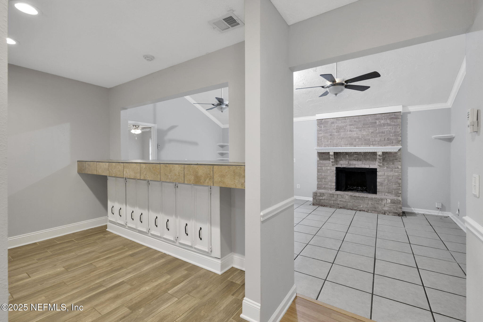 3452 North Ride Court Jacksonville, FL 32223 - Photo 8 of 39 a view of an empty room with a fireplace and a rug