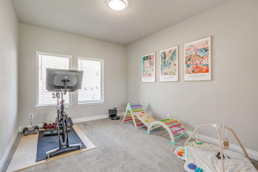 5709 Pope Creek Road Fort Worth, TX 76126 - Photo 29 of 39 Upstairs and right off the family living area is a spacious media room with endless possibilities for use and entertainment!