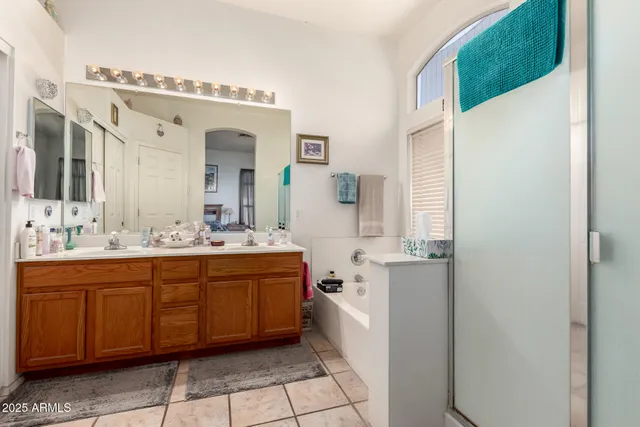 a spacious bathroom with a double vanity sink mirror and