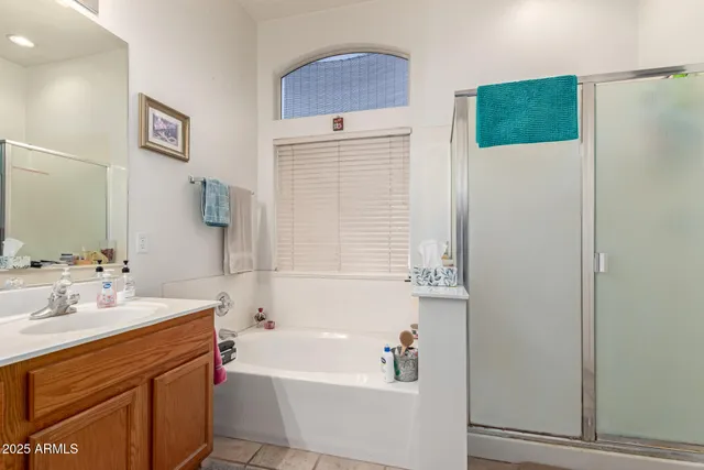 a bathroom with a sink a mirror and a bathtub