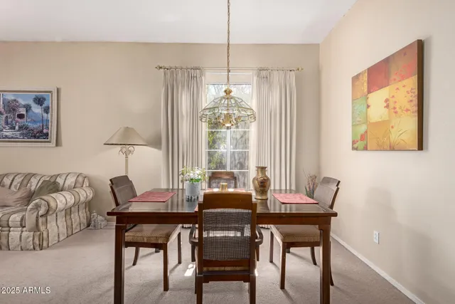 a dining room with furniture and window