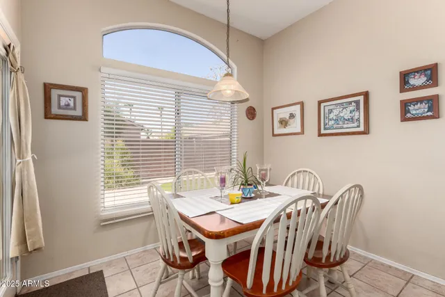 a dining room with furniture and window