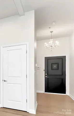 a view of a hallway with a washer and dryer