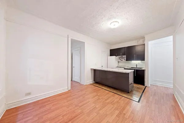 a large kitchen with stainless steel appliances kitchen island wooden cabinets and granite counter tops