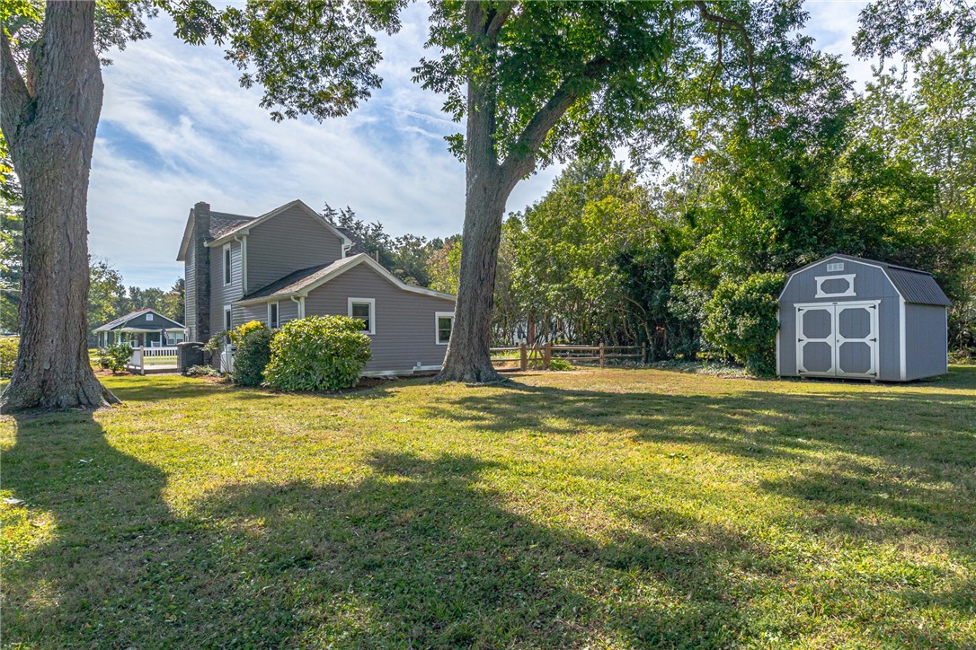 97 Virginia Road Irvington, VA 22480 - Photo 29 of 39 View of yard with a storage unit