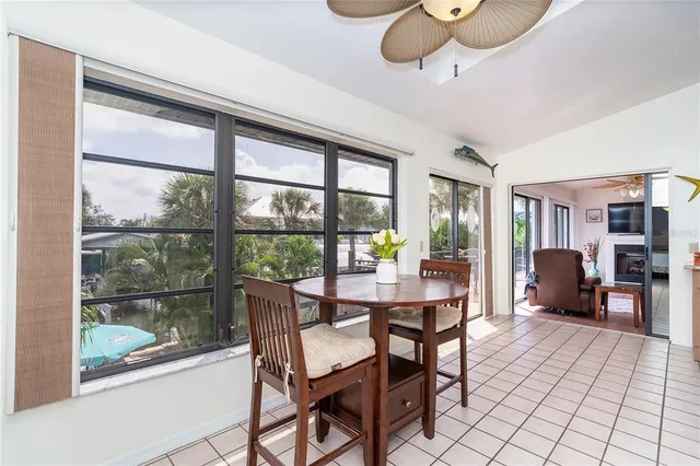a kitchen with a dining table and chairs
