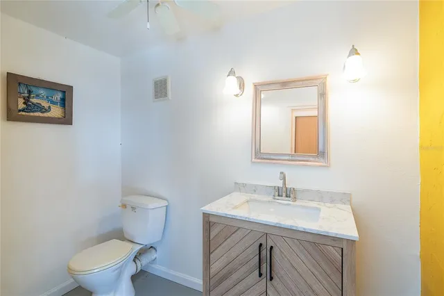 a view of a house with backyard porch and sitting area