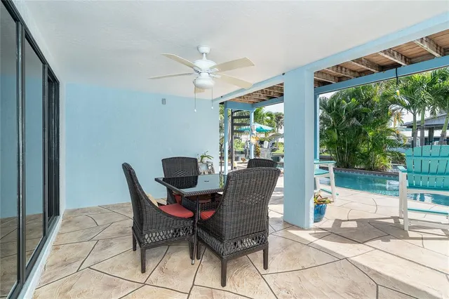 a view of a building with a large window and a yard