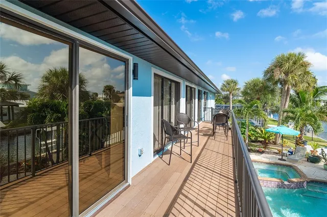 a view of swimming pool from a balcony