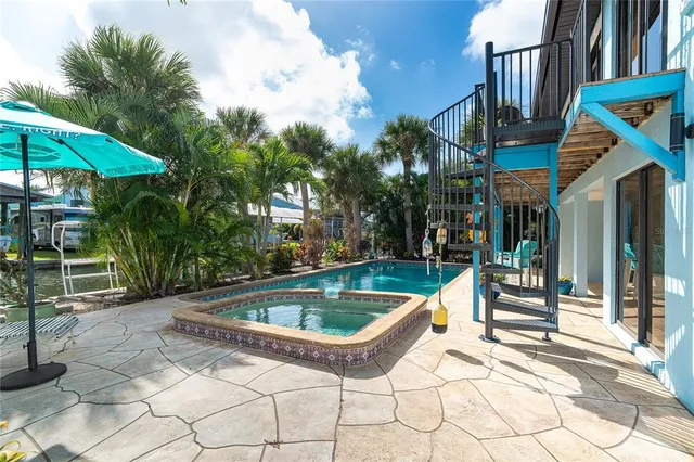 a view of a chairs and table in the patio