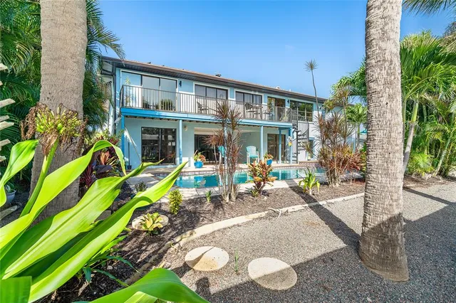 a view of swimming pool with outdoor seating