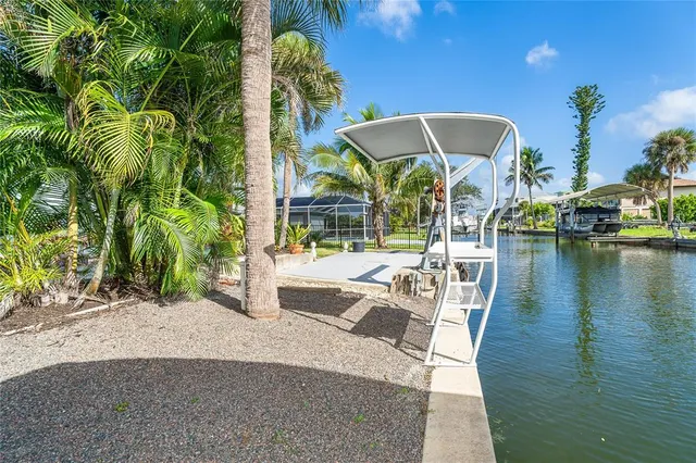 an aerial view of a house with a lake view