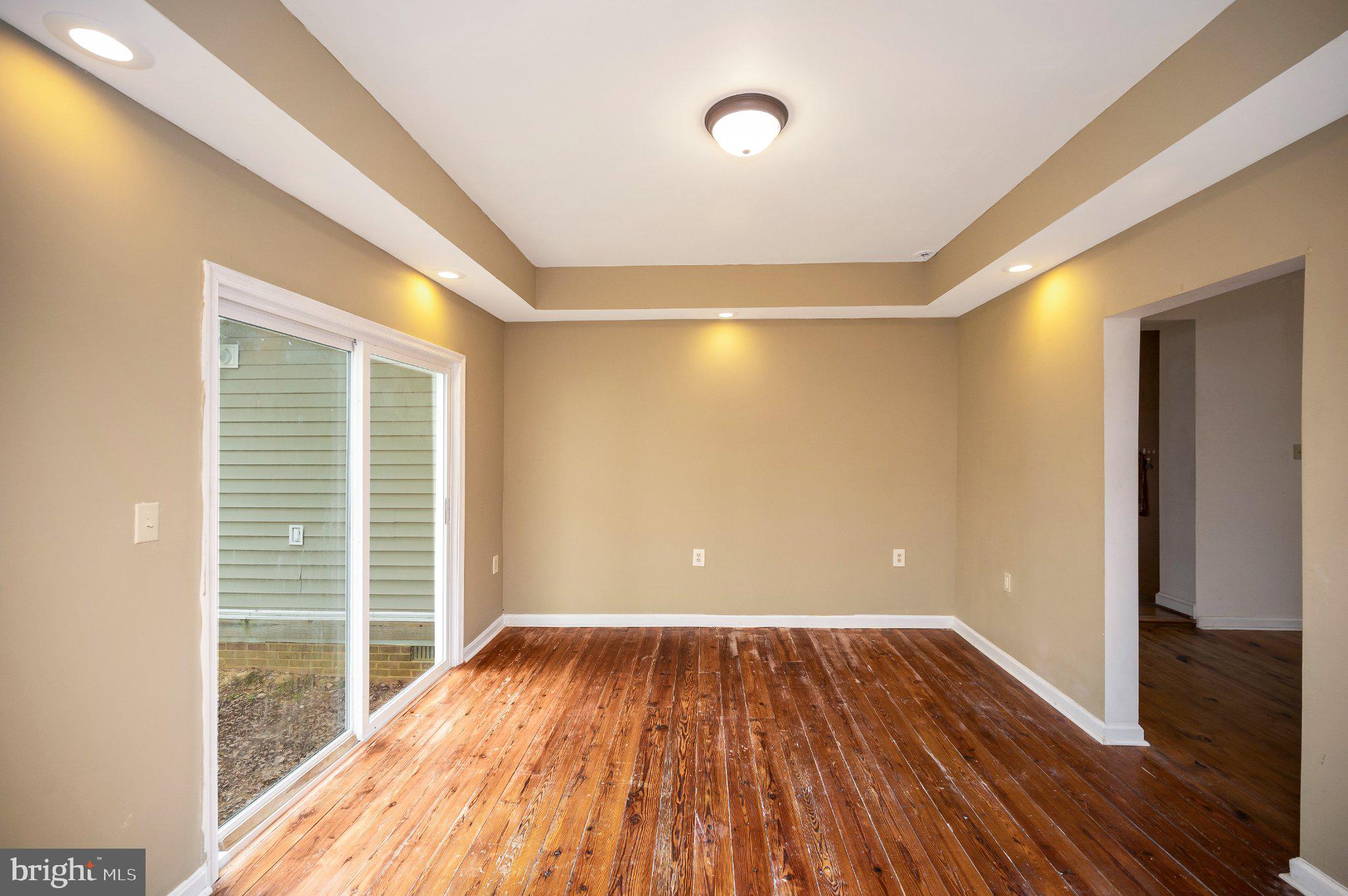 23202 Village Road Unionville, VA 22567 - Photo 14 of 58 a view of a room with wooden floor and a window