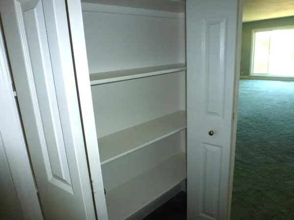 a view of an empty room with a window