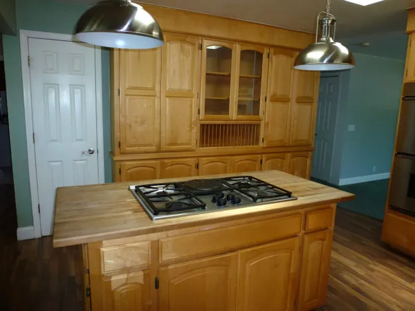 a kitchen with a sink and a refrigerator