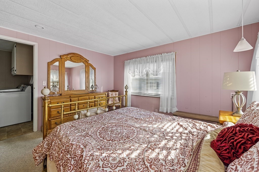 102 Peter Street Raynham, MA 02767 - Photo 16 of 23 a bedroom with a bed and a dresser
