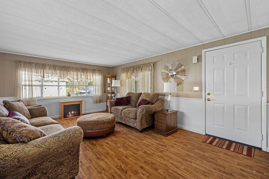 102 Peter Street Raynham, MA 02767 - Photo 2 of 23 a living room with furniture and a large window