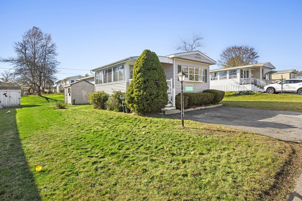 102 Peter Street Raynham, MA 02767 - Photo 21 of 23 a front view of a house with a yard